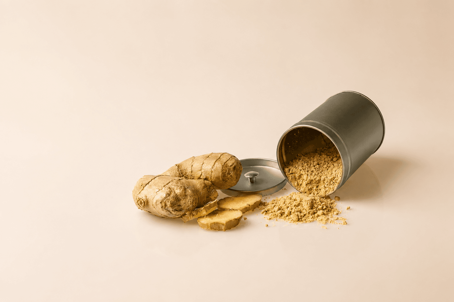 Fresh ginger roots, sliced ginger, and ground ginger powder beside an open metal container
